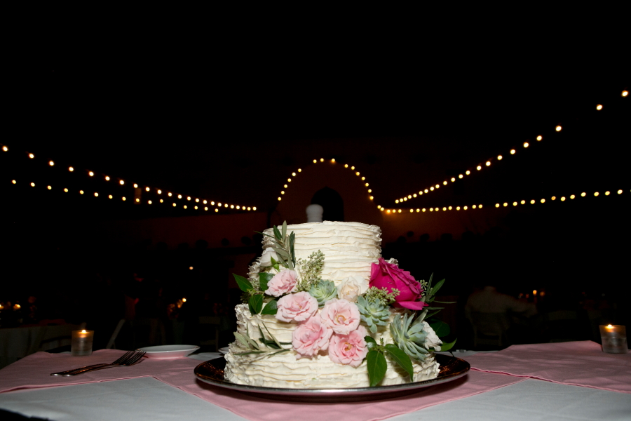 Wedding cake surrounded by night lights